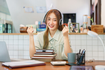 Coworking space office concept, Woman entrepreneur raise arms to celebrate after completing meeting