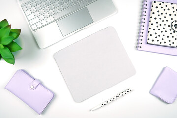 Mouse pad mockup. Styled with computer keyboard and modern desktop accessories. Negative copy space.