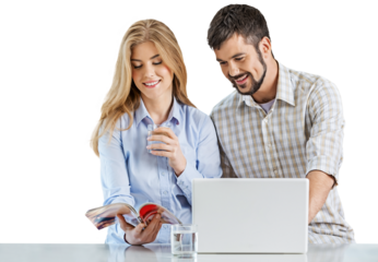 Young Couple Using Computer and Reading Book