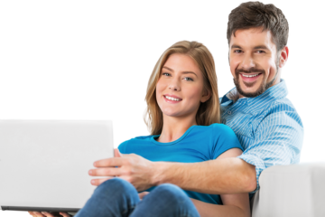 Young couple siting on sofa with laptop