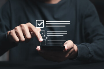 Businessman checking mark on checkboxes. Checklist concept.