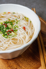 Vietnamese food rice noodle dish in a white bowl