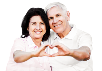 Portrait of happy senior couple showing heart sign