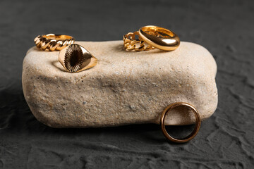 Stone with beautiful rings on black background