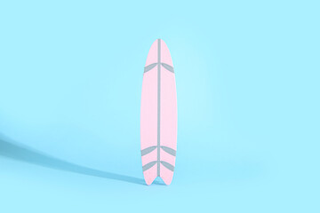 Mini surfboard on blue background