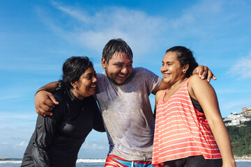 Happy latin friends teenagers at beach having fun at pacific ocean in Acapulco Mexico Latin...