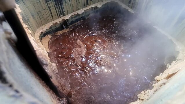 Purifying and dissolving crude soap in factory chambers with chemicals and ingredients