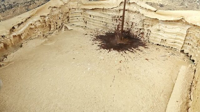 Purifying and dissolving crude soap in factory chambers with chemicals and ingredients