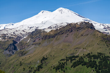 Elbrus mount on a sunny June day. View from Cheget mount. Kabardino-Balkaria, Russia