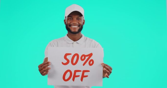 Black man, billboard and sign for discount sale, advertising or marketing on mockup against a studio background. Portrait of African male person with poster for deal, notification or pay half price