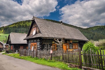 Fototapeta na wymiar Village with old wooden houses in Slovakia village Cicmany. Čičmany is a village in Slovakia in the district of Žilina