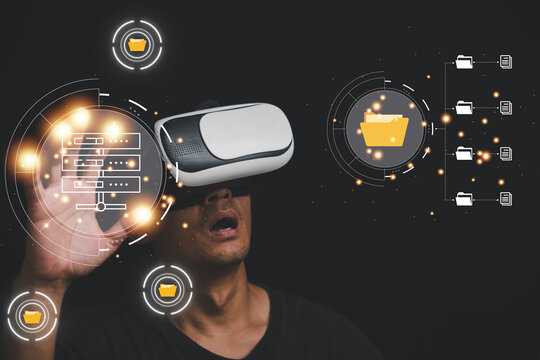 Man in VR glasses touching virtual Global Internet connection metaverse, Document Management System for online documentation database management. Future technology is revolutionizing file management