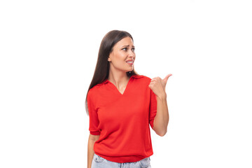 surprised brunette woman in a red stylish v-neck blouse shows her hand to the empty space