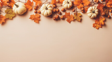 Obraz na płótnie Canvas Autumn leaves and pumpkins on a beige background. Minimal Thanksgiving concept. Flat lay
