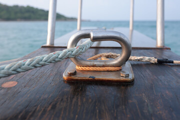 White rope attached to stainless steel on the boat