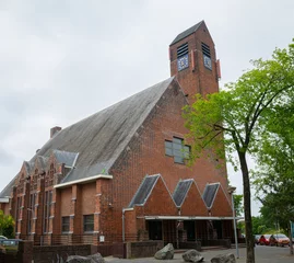 Fotobehang Protestant church called "Prinses Julianakerk" in the fishing village of Duindorp, close to the city of The Hague, Holland © Menyhert