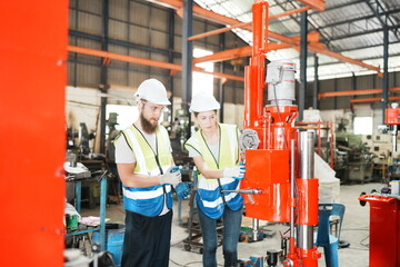 Industrial Engineer at work in factory, industrial engineers working at automated AI robotic production factory - New technology concept