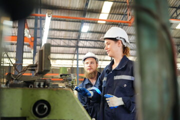 Industrial Engineer at work in factory, industrial engineers working at automated AI robotic production factory - New technology concept