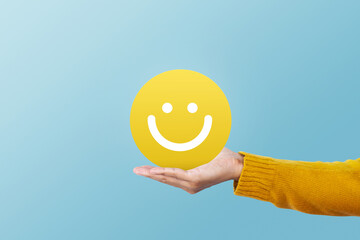 Customer show speech balloon with smile emoticon for rating. Service rating, feedback, satisfaction...