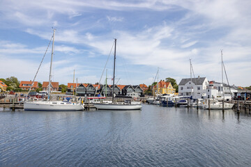 Fototapeta na wymiar Visit to Lohal's harbor with many fishing boats and leisure boats in Langeland, Denmark