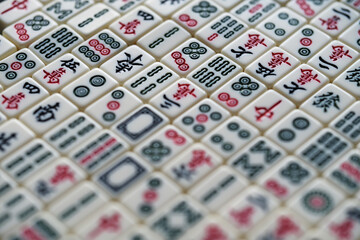 close up many Chinese mahjong tiles background. Traditional board game in China
