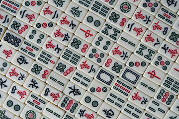 top down view of many Chinese mahjong tiles background. Traditional board game in China