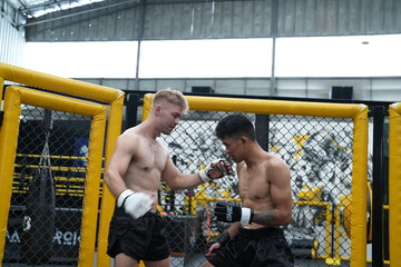 Two professional boxers fighting at the gym