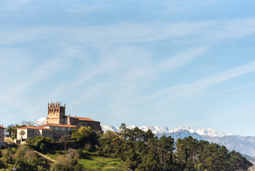 Fototapeta na wymiar Panoramic view of the medieval castle of the tourist village of San Vicente de la Barquera in Cantabria, situated high in the mountains surrounded by and Picos de Europa.