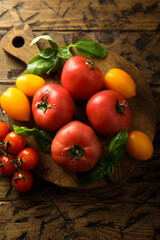 Fresh ripe tomatoes on a wooden desk