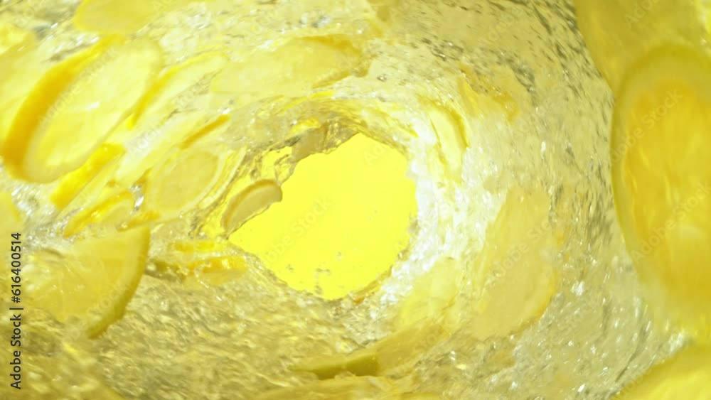 Fototapete super slow motion of water wave with lemon slices. water surf wave rotating around in creating tunne