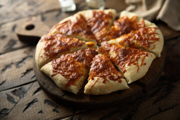 Homemade pizza with tomato sauce and cheese