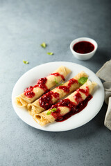 Homemade crepes with raspberry sauce