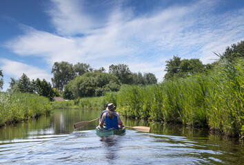 Fototapeta na wymiar Canoe. Canoeing at Belt Schutsloot. Near Giethoorn. National park de Wieden and Weerribben. Kayak. Netherlands.
