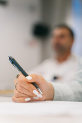 Close up shot of girl holding a pen 