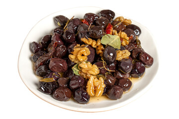 Mixed olives isolated on white background. Black olives prepared with walnuts and spices. Gourmet delicacies. close up