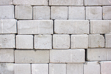 Obraz premium Pallet of bricks. Stacked bricks. Construction materials, white silicate brick.