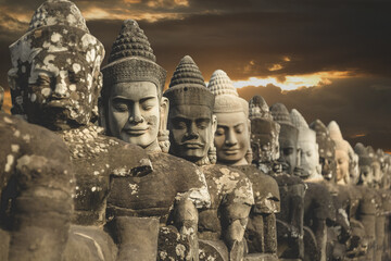South-East Asia, Cambojia,Siem Reap, Angkor Thom march 2, 2017. Deva or deity row at entrance of Angkor Thom,Siem Seap, Cambodia.. - obrazy, fototapety, plakaty