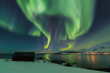 Aurora borealis over the Lyngen Alps in Arctic Norway