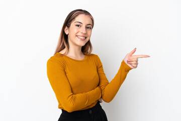 Young caucasian woman isolated on white background pointing finger to the side