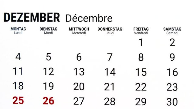 Time lapse zoom out motion of calendar month of December in german and french