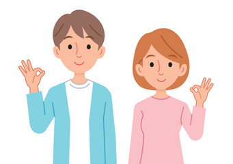 笑顔でOKサインをする男女