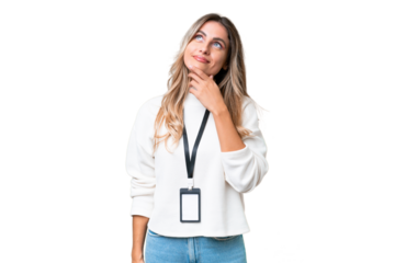 Young Uruguayan woman with ID card over isolated background and looking up