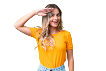 Young Uruguayan woman over isolated background saluting with hand with happy expression