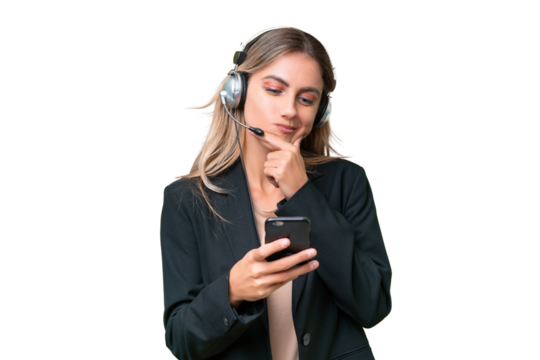 Telemarketer pretty Uruguayan woman working with a headset over isolated background thinking and sending a message