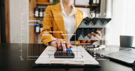 Businesswoman hand Project manager working and update tasks and Gantt chart scheduling virtual diagram.with smart phone, tablet and laptop