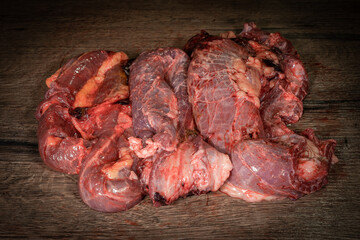 Side view Close up denver Steak, Flank steak, cut near denver alternative beef steak and a cleaver butcher meat knife a rustic metall background selective focus