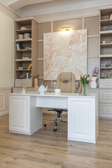 a close view of the home office in a modern cozy soft interior in warm delicate pastel pink and beige colors