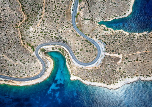 Panoramic aerial view of the popuar Limanakia bays in Vouliagmeni, Athens, Greece, with little bays and turquoise sea for tourists and locals