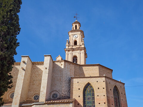 Building of the Collegiate Church of Santa Mar&iacute;a la Mayor, also called La Seu, and the bell tower with a clock. Gandia, province of Valencia, Spain, Europe