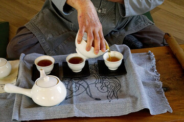person preparing meditation tea